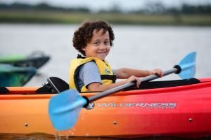 close up of young boy on kayak