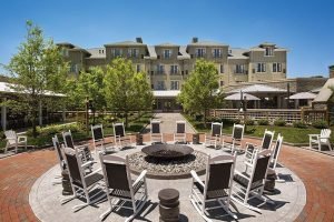 view of chesapeake bay beach club from fire pit with blue sky