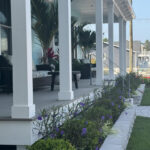 the front of a house with a lawn and landscaping