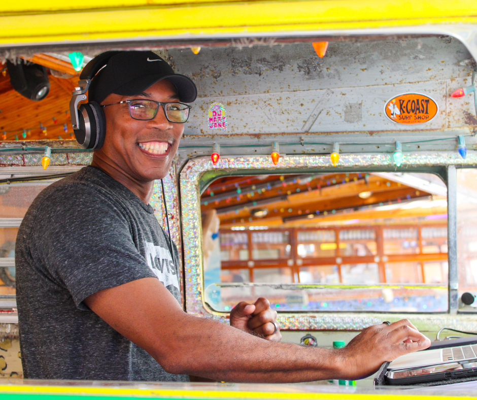 a man wearing headphones sitting in a food truck