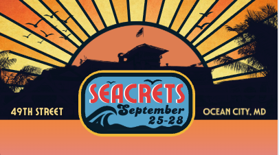 a poster for a concert with a sunset in the background