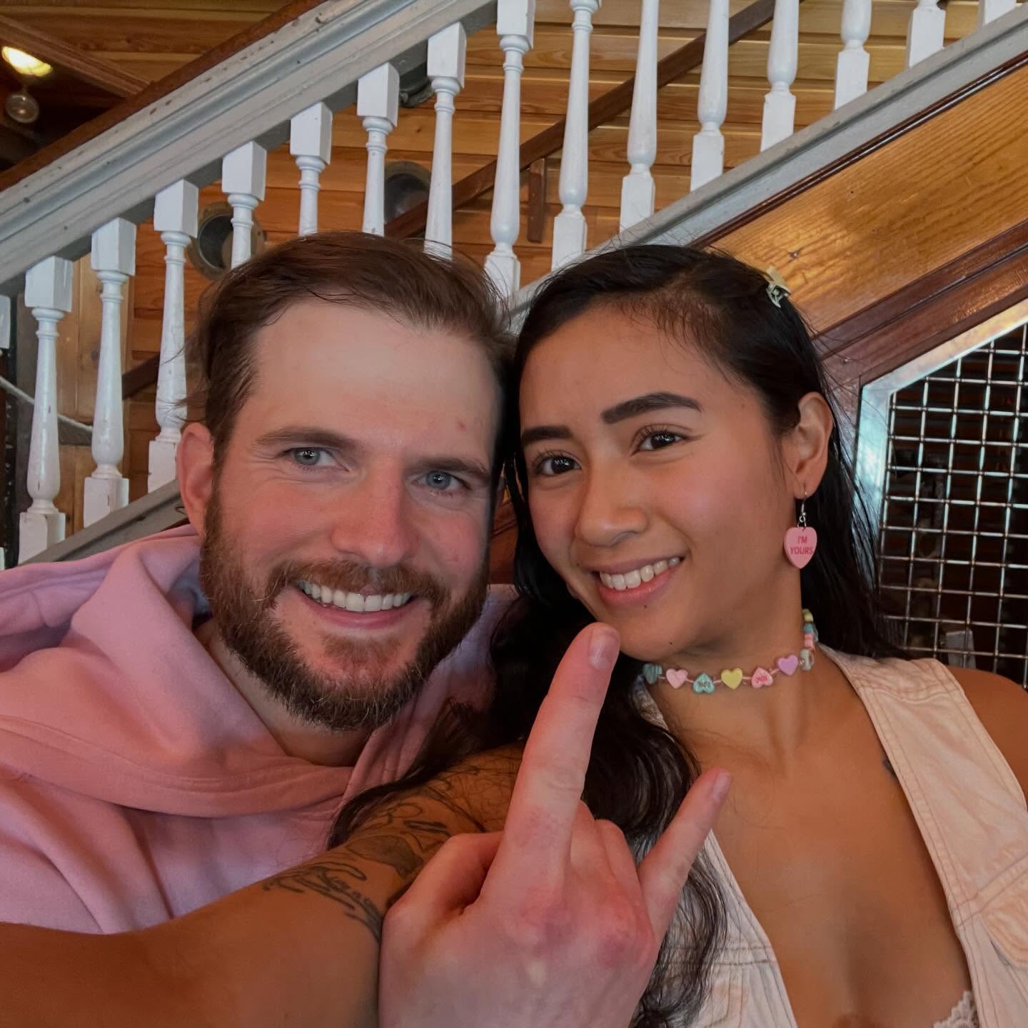 a man and a woman posing for a picture