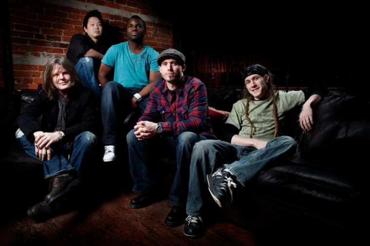 a group of people sitting next to each other on a couch