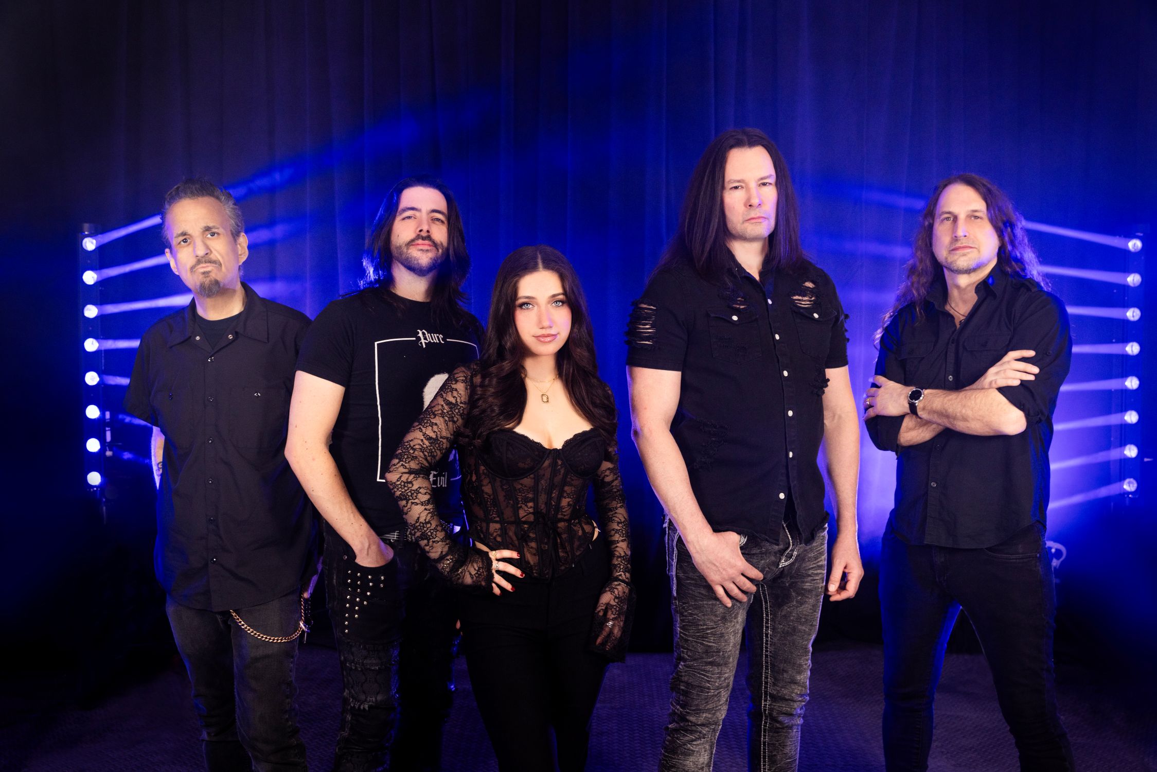 a group of people standing in front of a stage