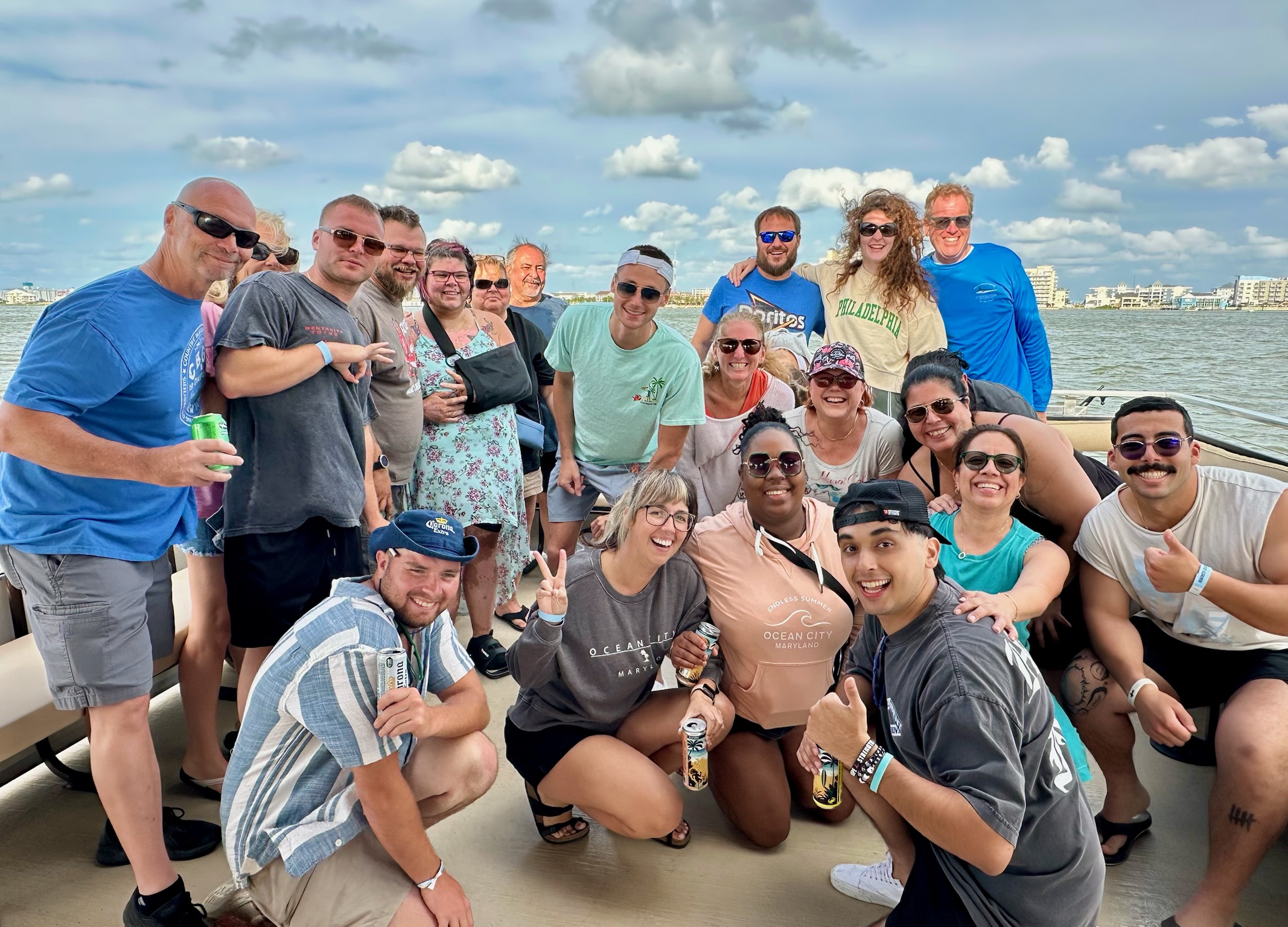 a group of people on a boat posing for a picture