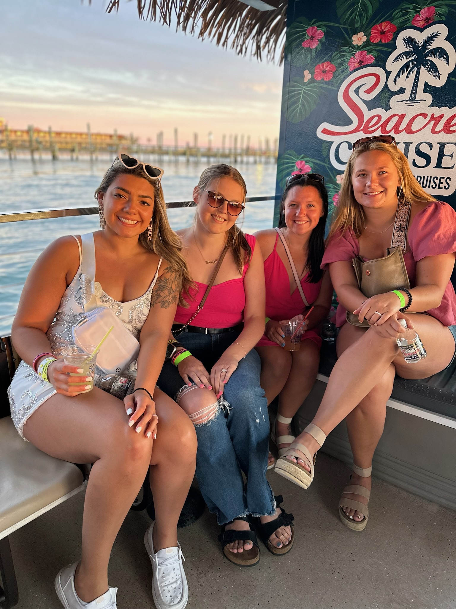 a group of women sitting on top of a boat