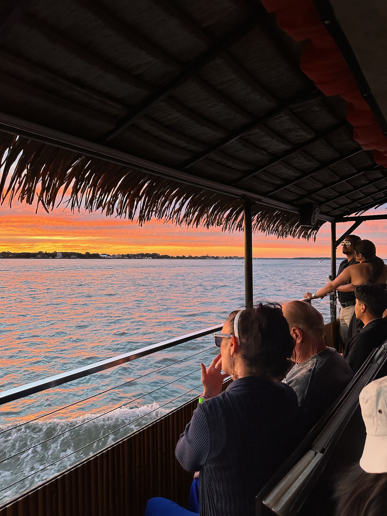 a group of people riding on top of a boat