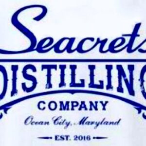 a white sign with blue lettering that says seacrests distilling company