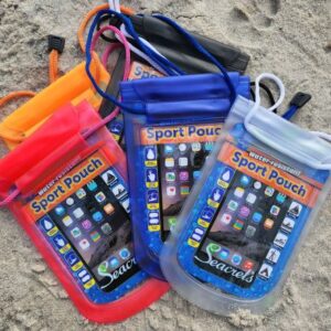a group of cell phones sitting on top of a sandy beach