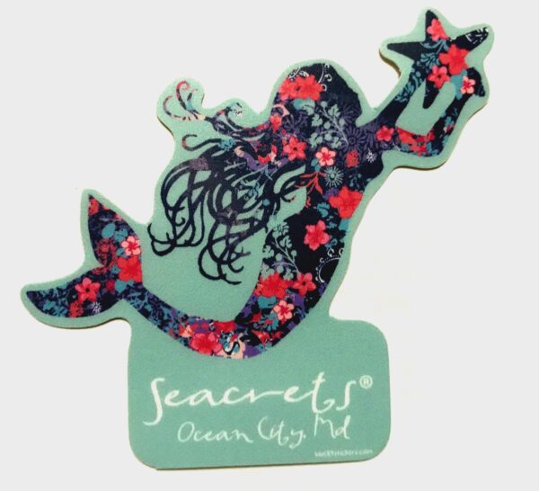 a sticker of a mermaid with flowers on it