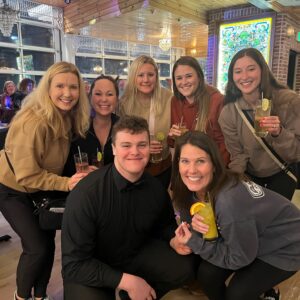 a group of people posing for a picture in a restaurant