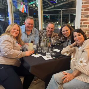 a group of people sitting around a table