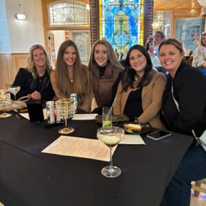 a group of women sitting around a table