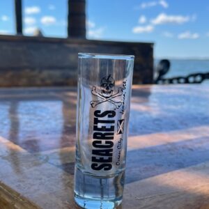 a bottle of vodka sitting on top of a wooden table