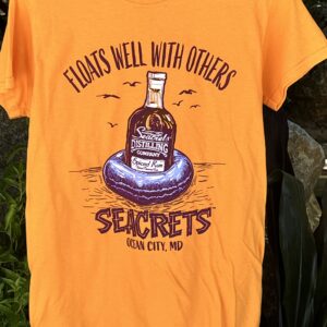 an orange shirt with a bottle of whiskey on it