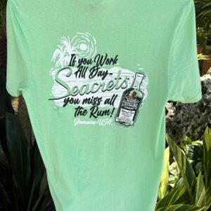 a green t - shirt with a picture of a can of soda on it