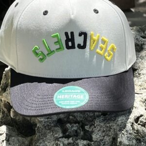 two hats that are sitting on a rock