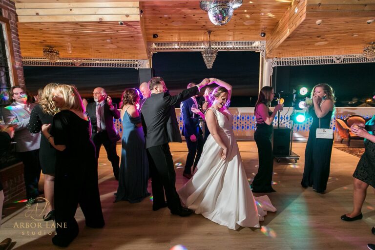 a bride and groom dancing at their wedding reception
