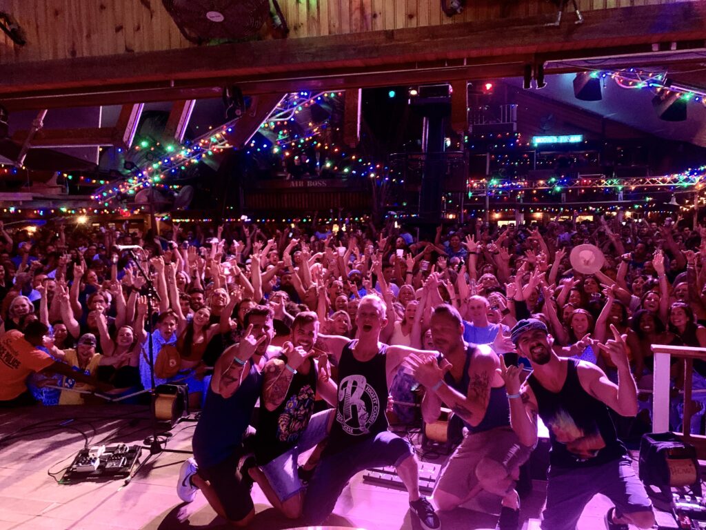 a large group of people standing in front of a crowd