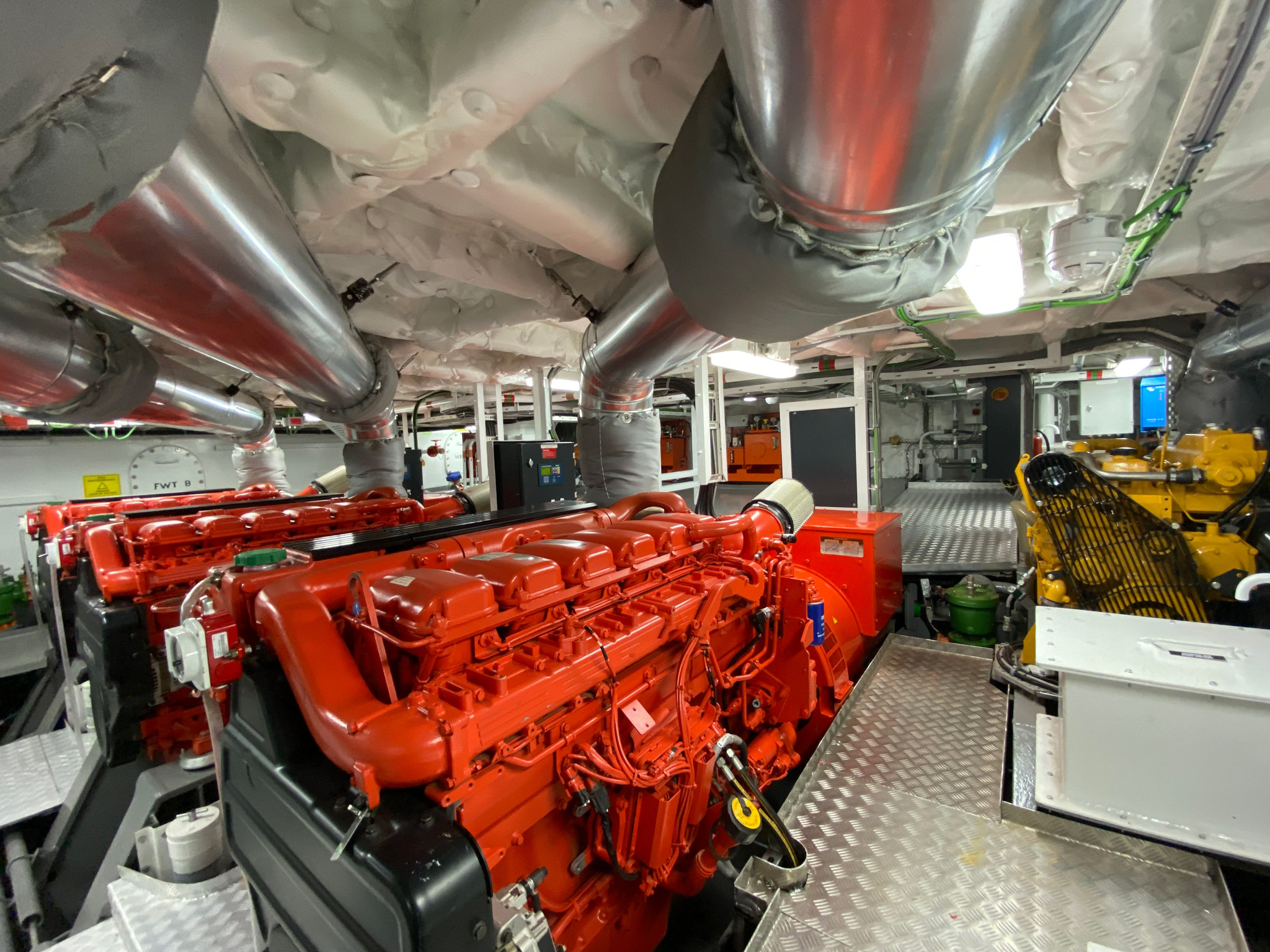 the inside of a boat with a large engine