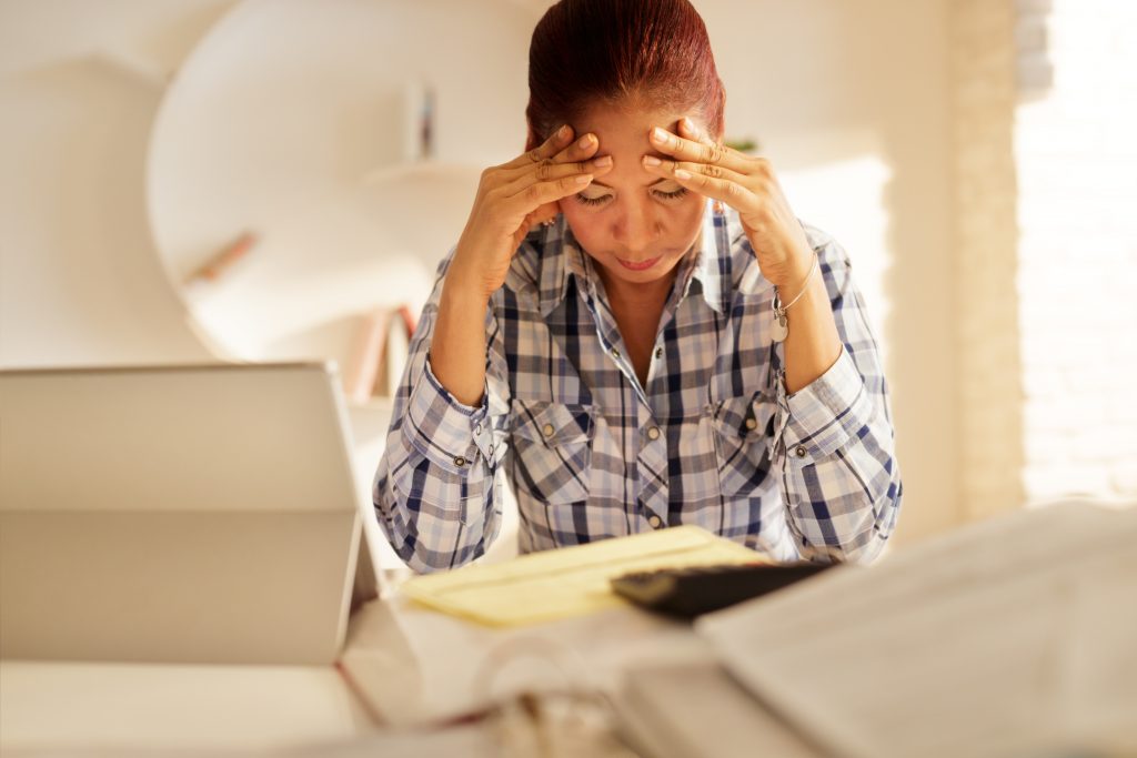 Frustrated Senior Woman Paying Bills And Filing Federal Tax Return