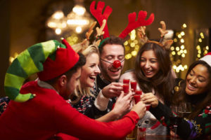 friends celebrating Christmas at a bar