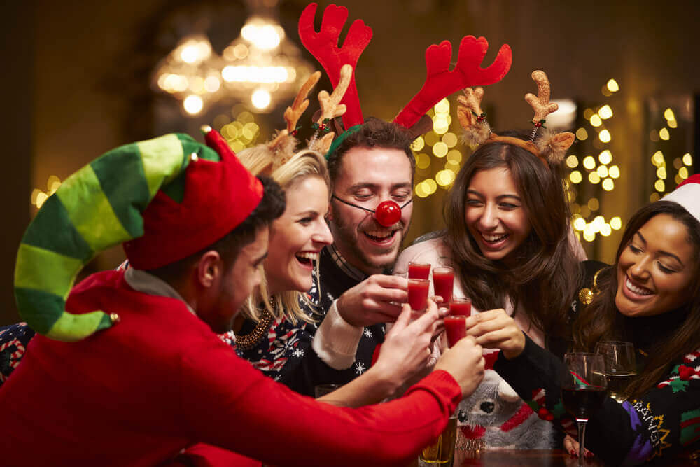 friends celebrating Christmas at a bar
