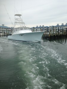 a white fishing boat in the bay