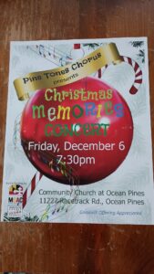 a poster for a christmas concert on the side of a building