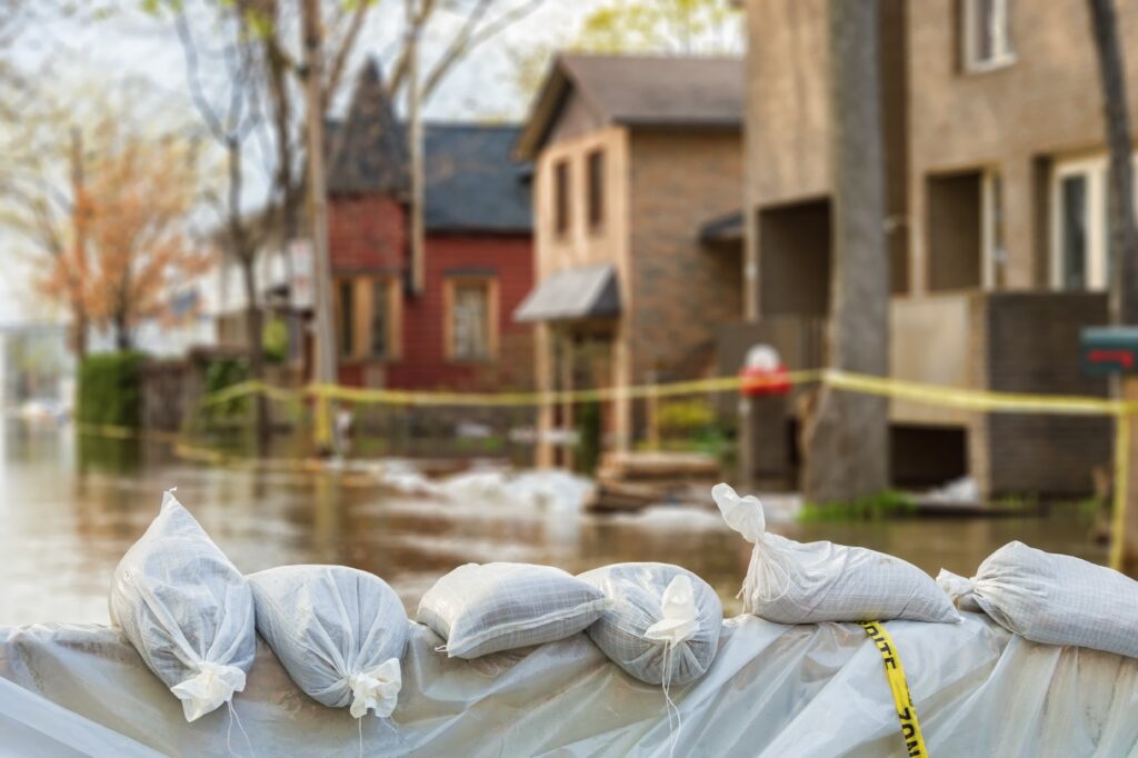 Flooded street with houses in the flood zone