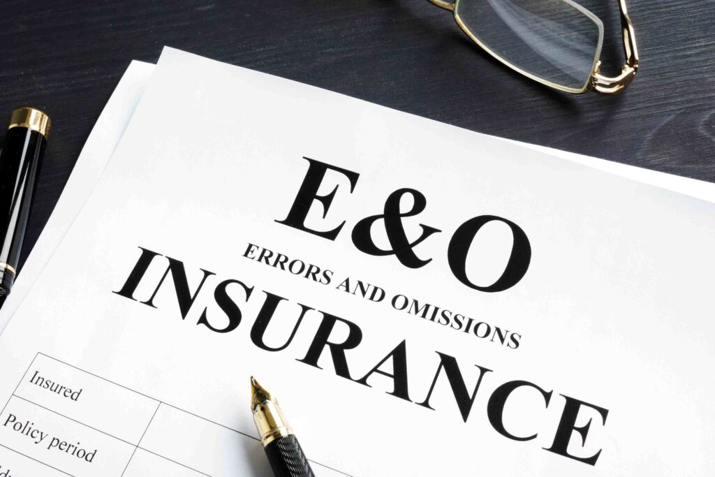 a pen and glasses sitting on top of an e & o form