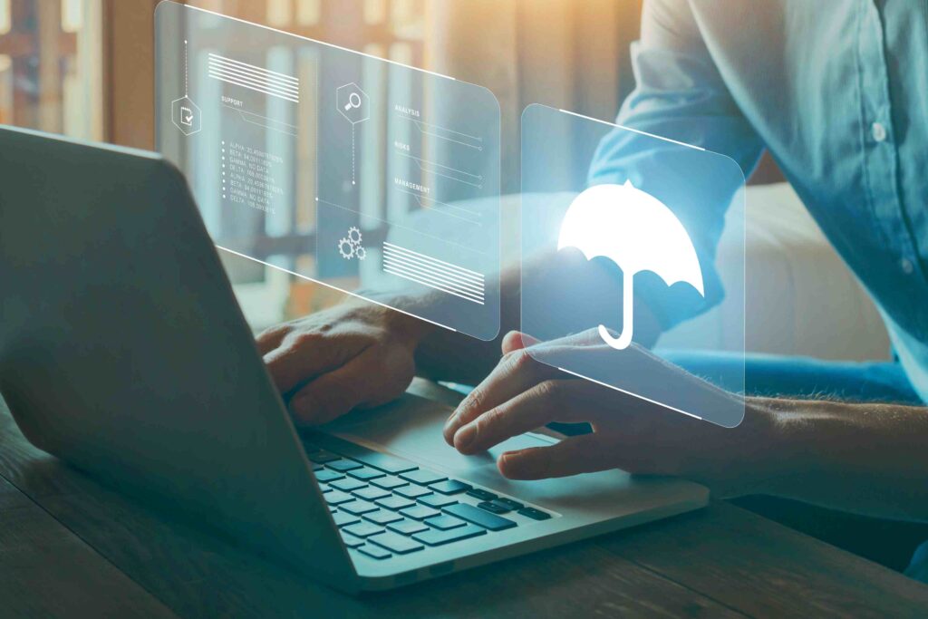 a person using a laptop with an umbrella on the screen