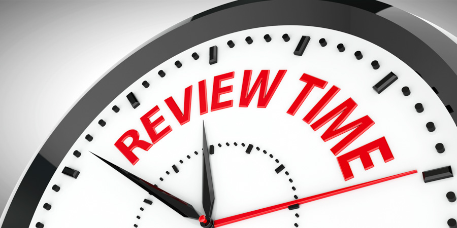 a close up of a clock with the words review time
