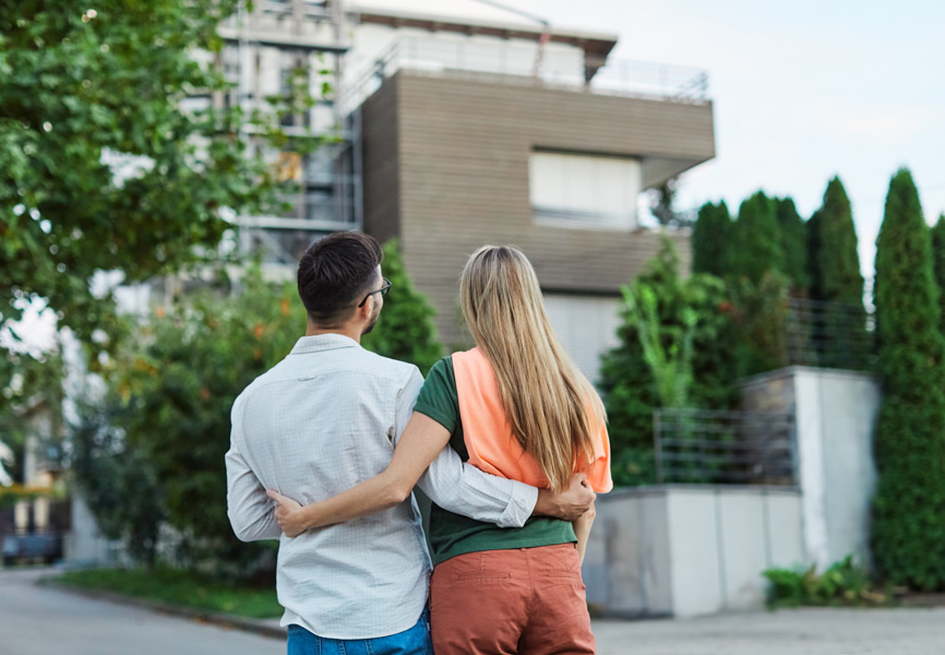 a man and a woman walking down the street