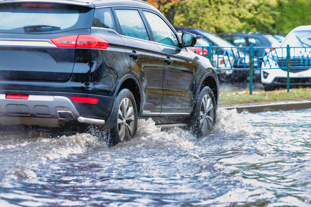 car driving on flooded road
