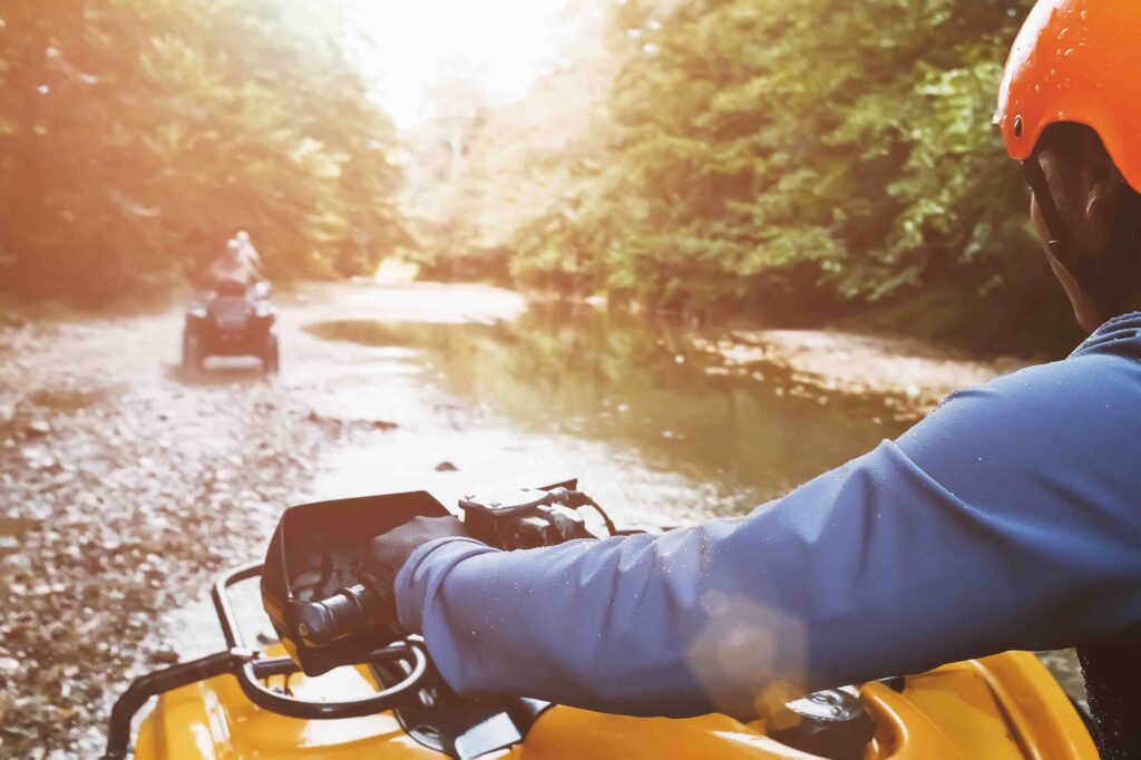 people riding ATVs