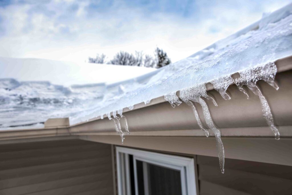 icicles hanging from the roof of a house