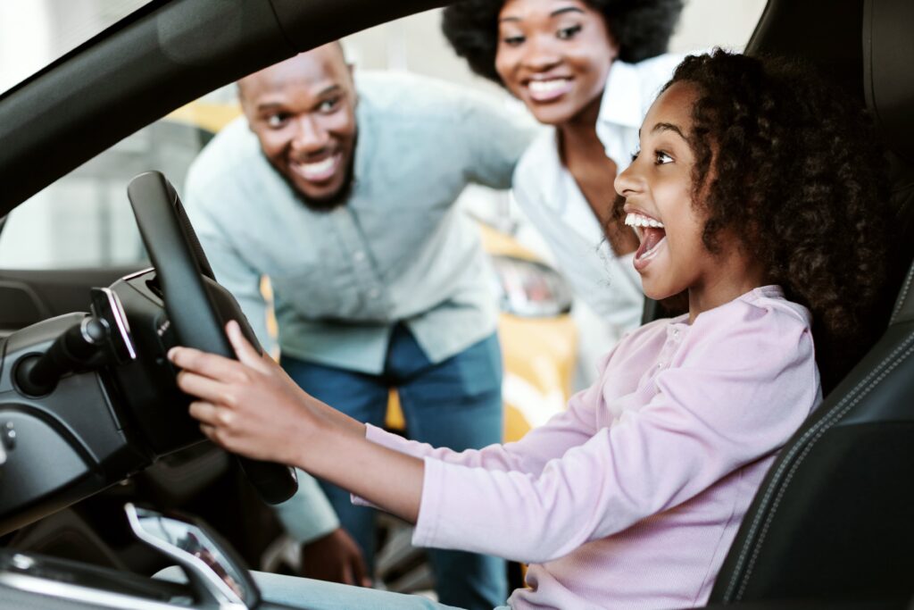 a couple of people that are sitting in a car