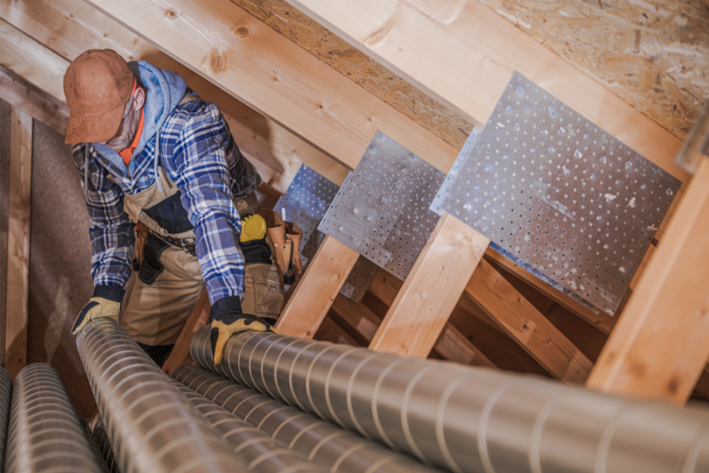 HVAC Technician working on the air vents