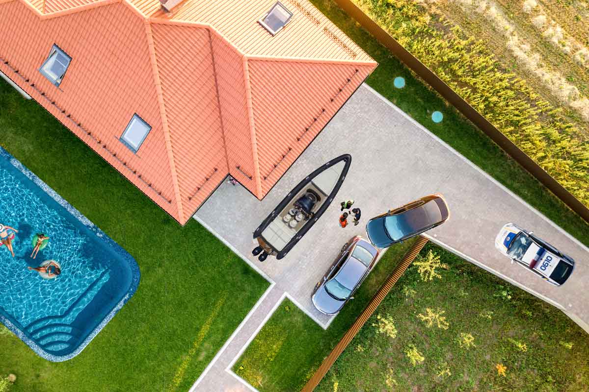 an aerial view of a house with a swimming pool