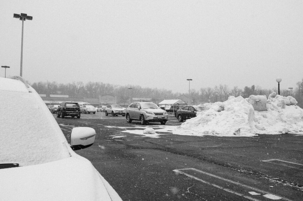 a bunch of cars that are parked in the snow