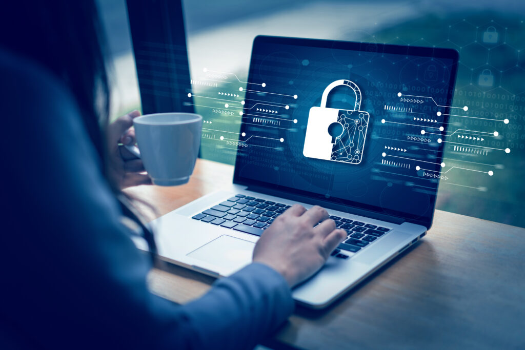 a person using a laptop with a padlock on the screen