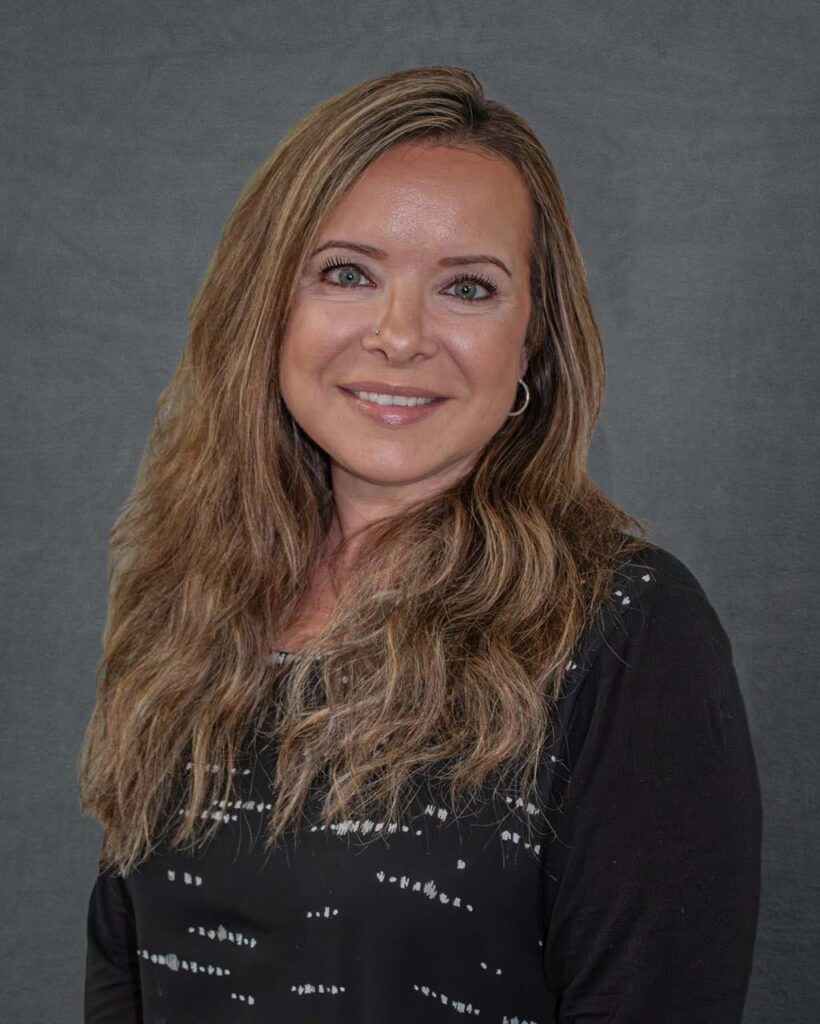 a woman with long hair and a black shirt