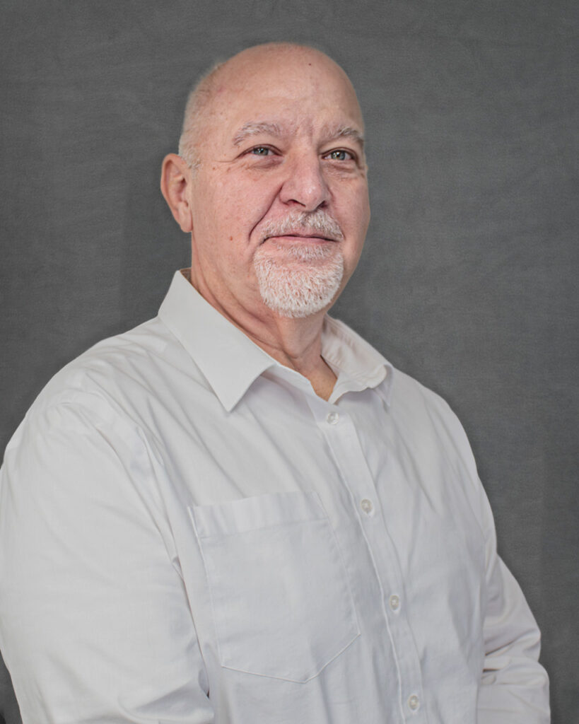 a man in a white shirt is posing for a picture