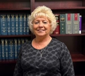 Rhonda Head Shot in front of Bookcase