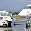 white truck fueling white plane