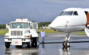 white truck fueling white plane