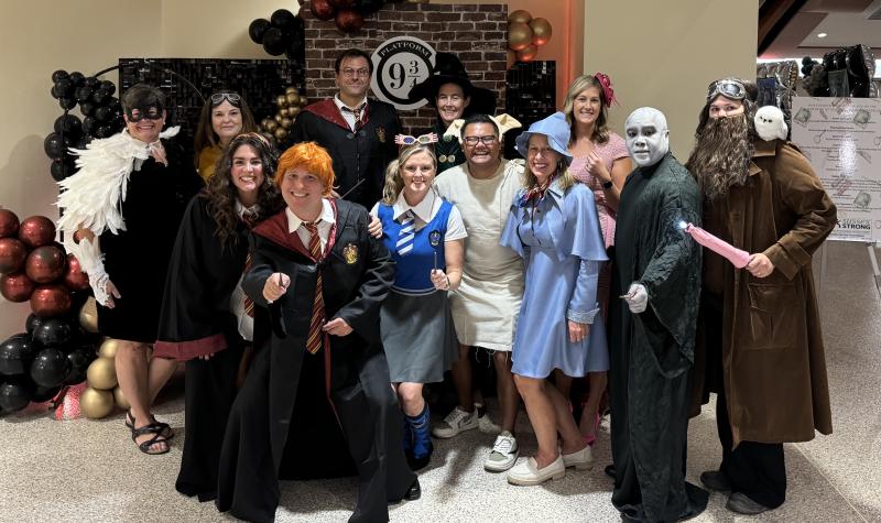 a group of people in costumes posing for a picture
