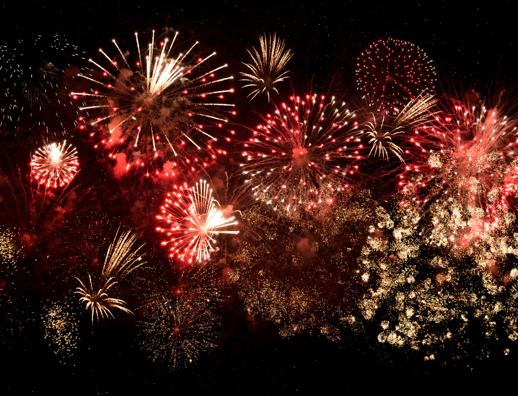 a bunch of fireworks are lit up in the night sky