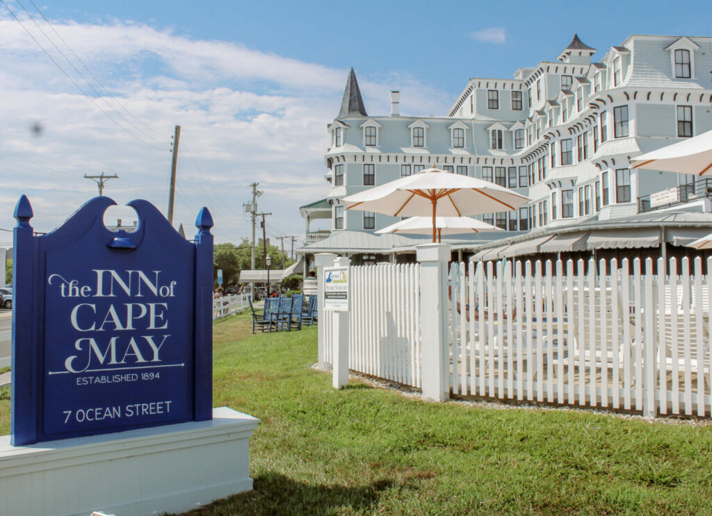 The Inn of Cape May Sign and hotel in the background